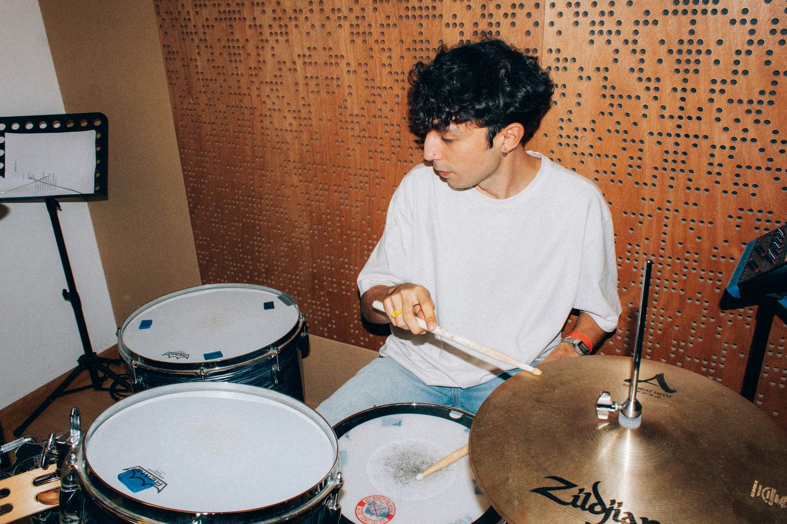 A young musician at a drum kit